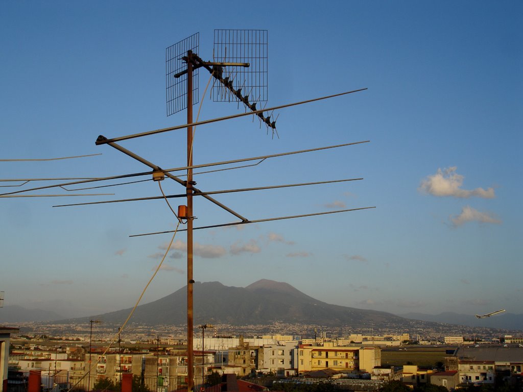 Naples lazy afternoon: dormant Vesuvius and leaving plane by Luca Terracciano