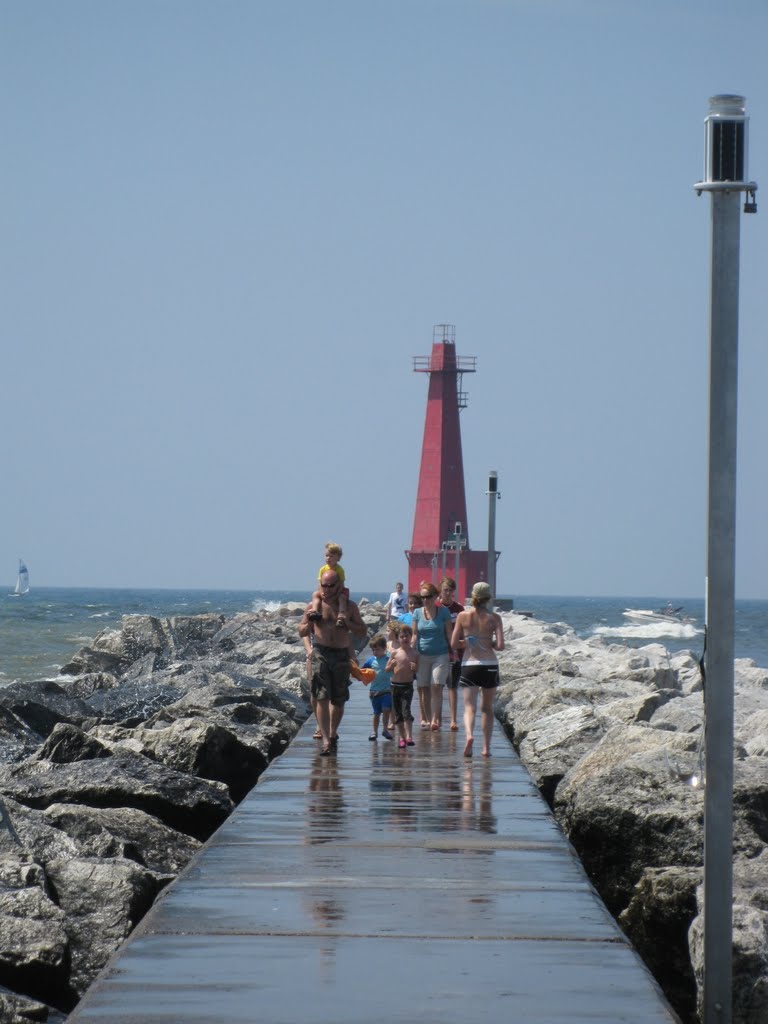 Solar powered lights with Muskegon south pier outer lighthouse by UnagiUnagi