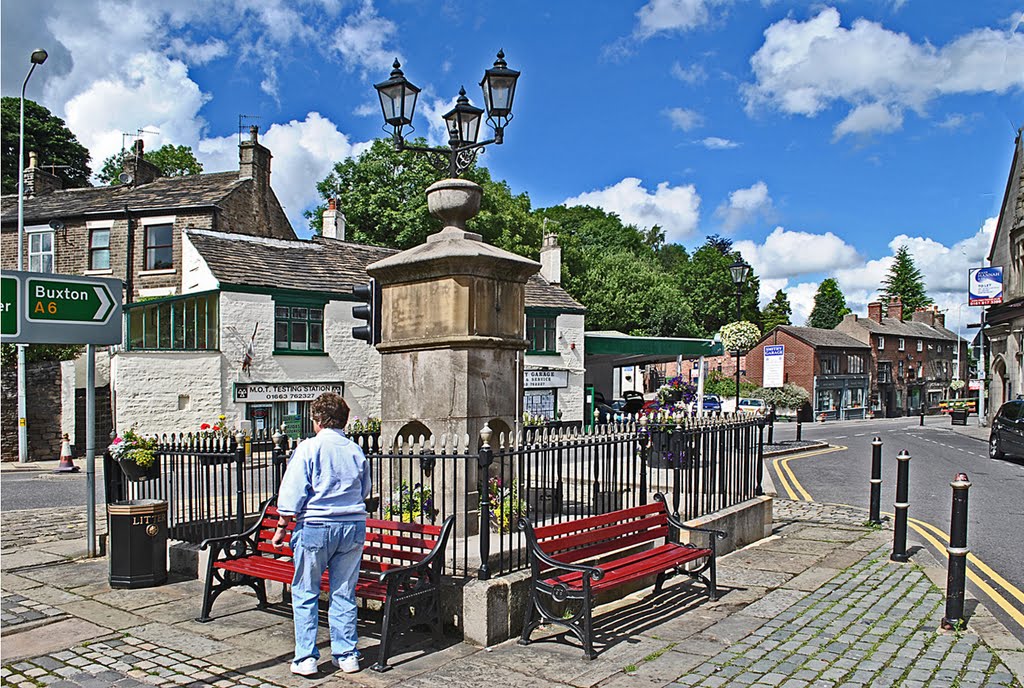 Fountain Square, Disley. The Fountain was presented to the village by the Orford family in 1834. Water was collected from the hillside near the parish church and piped into the fountain, where is was stored in a lead tank at the top. The light fitting was added in 1999, as a permanent memorial to the Millennium. by Jeff Annely