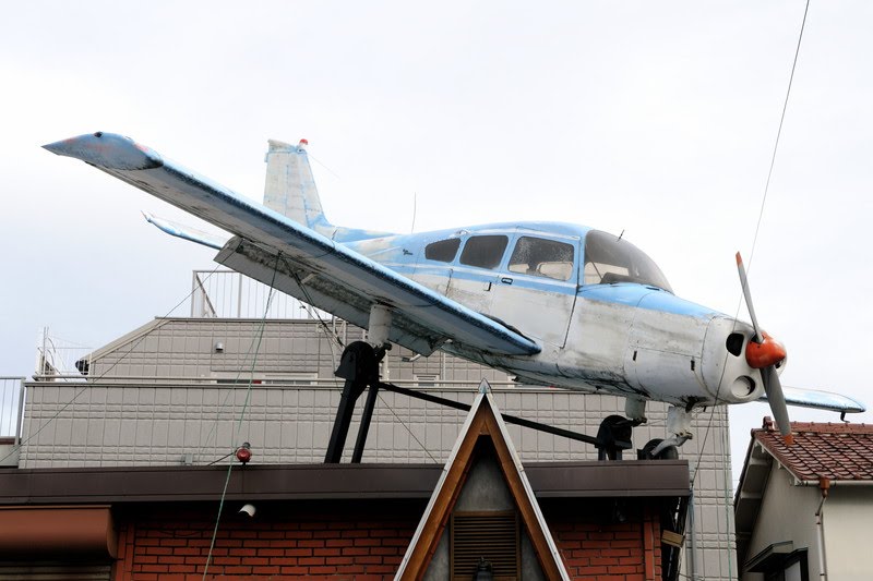 Beechcraft Musketeer displayed on a street by Booskanoriri