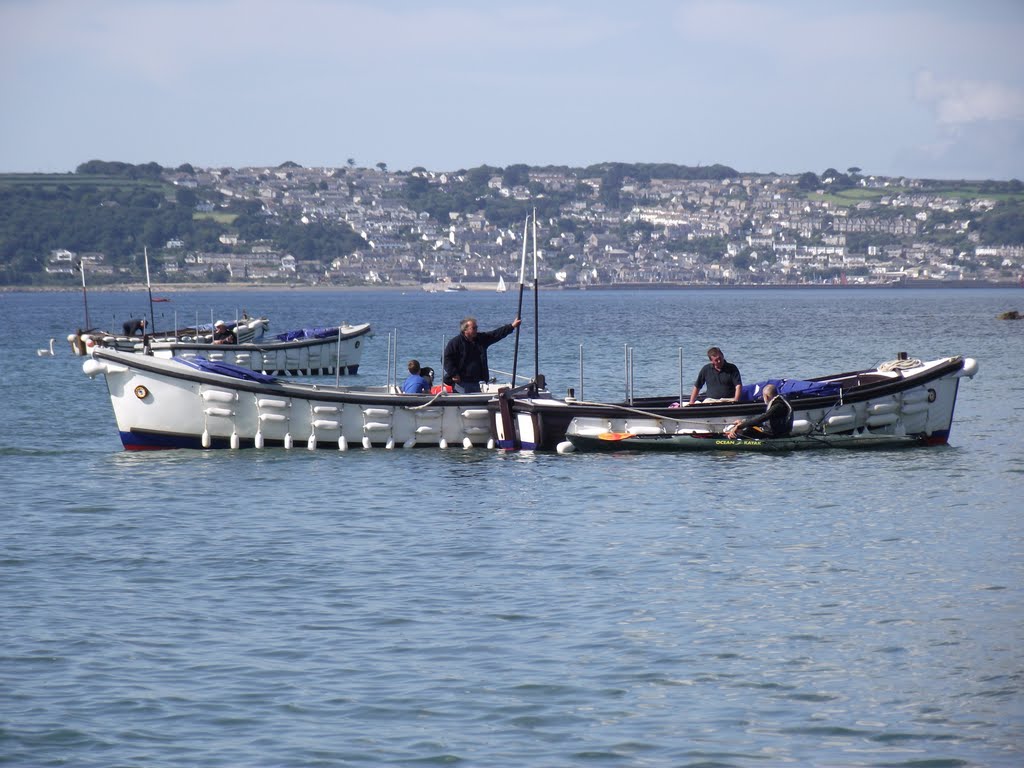 St Michaels Mount taxi Boat & Penzance in the background by Andrew Johnson