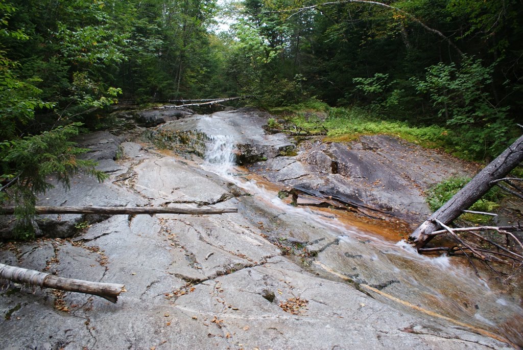 Water on rocks Falling waters trail Franconia New Hampshire by Richard Baillargeon