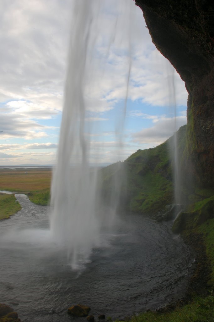 Seljalandsfoss from behind by Flurin Juvalta