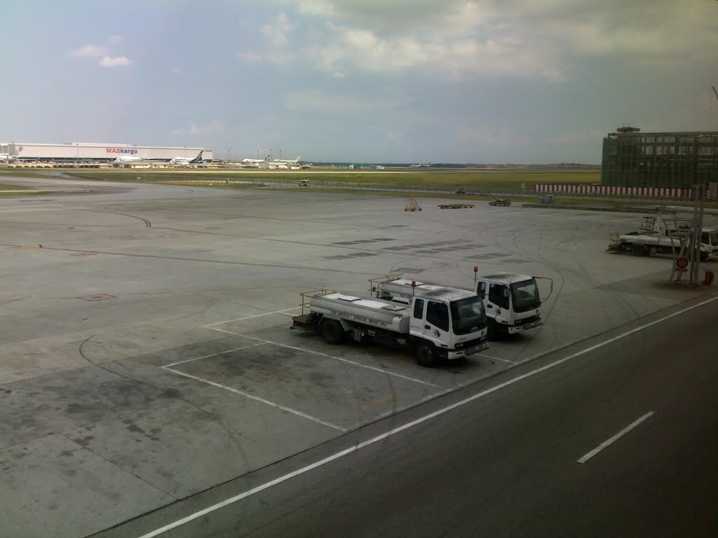 Parked Ground Service Vehicles at the ramp - Kuala Lampur Intl Airport, 2010. by Jude Ashvin Lobo She…