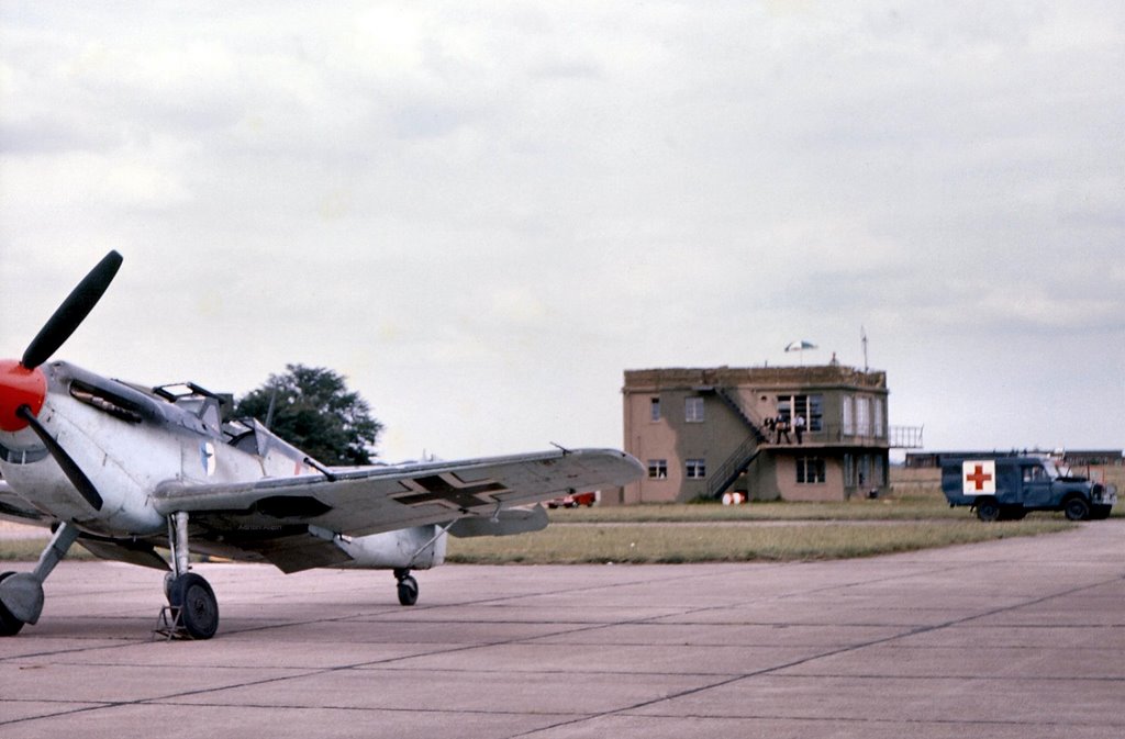 Duxford 1968 - B of B film - Me109 & ATC tower. by Adrian Allain