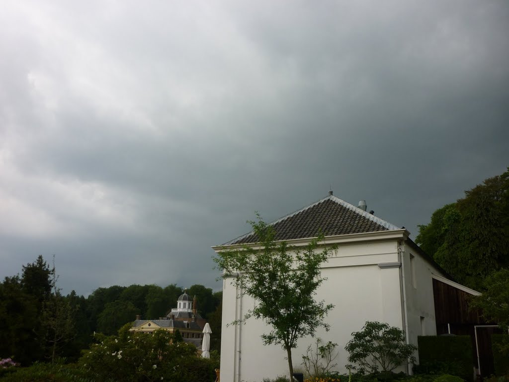 Heavy showers heading for Rosendael. Castle in the backdrop, orangery in the foreground. by denhertog