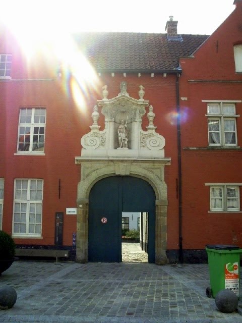 Belgium : Oudenaarde : Entrance to "Begijnhof" with the statue of the plaige saint ** Saint Rochus** by tinawaldo