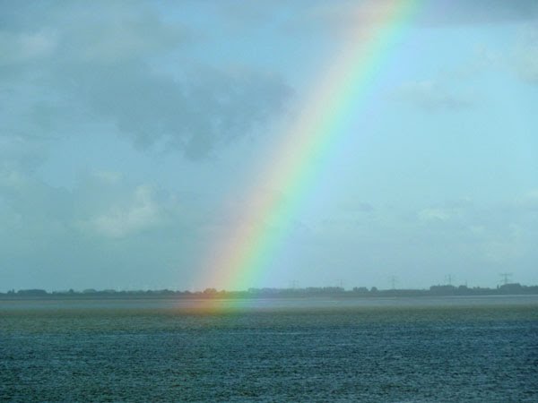 Rainbow over the Westerschelde at Hansweert by mandyvangoeije