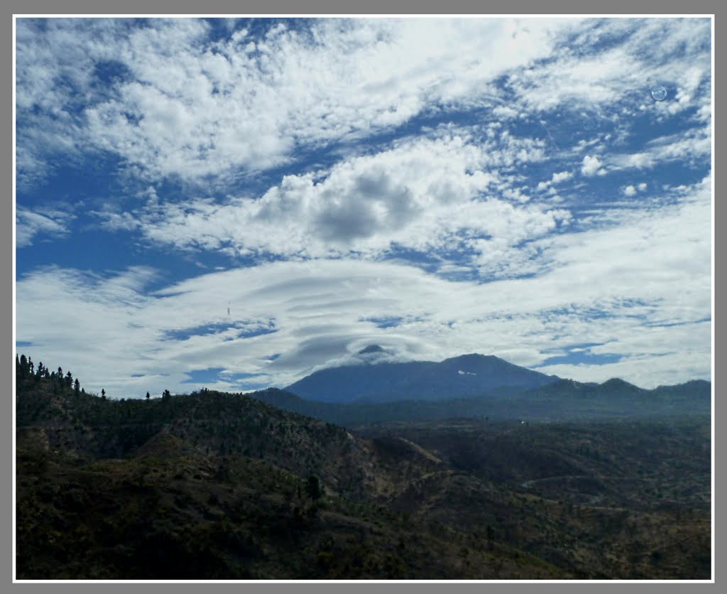 Mount Teide. with 'stack' of lenticular clouds. by david g Johnson