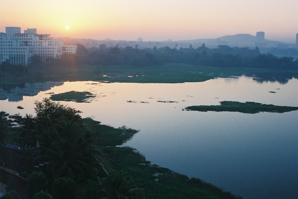 Room with a view of the sun rising over Powai Lake #1 by Brian Burnett