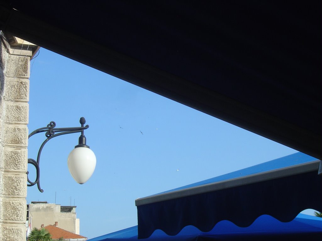 Lamp on a blue sky by Perinic D