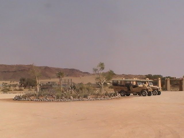 Tourist excursion vehicles @ Sossusvlei Lodge by Isaak Fam (Namibia)