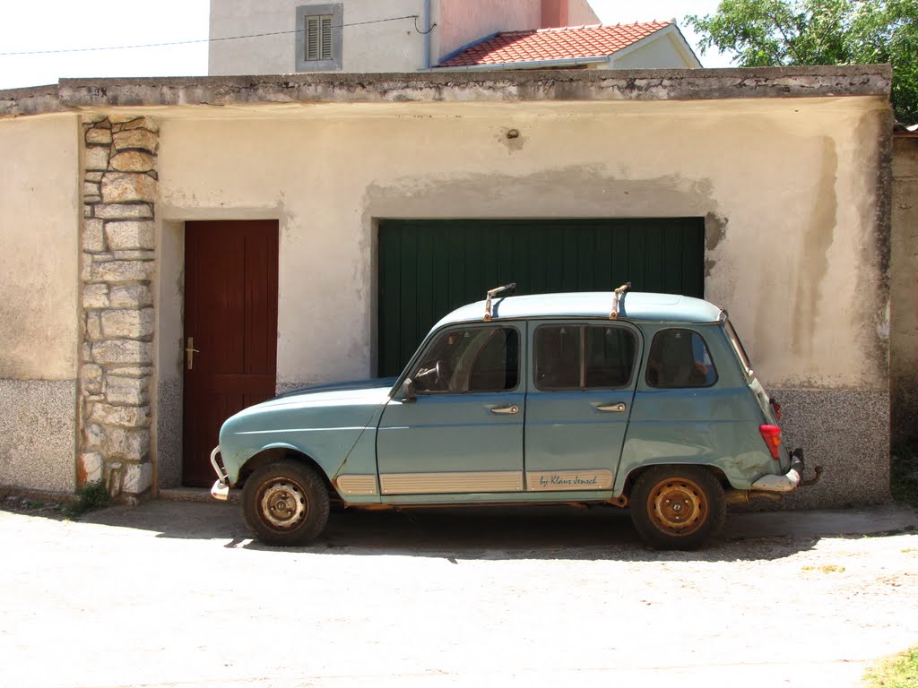 Old car in front of the garage by Klaus Jensch