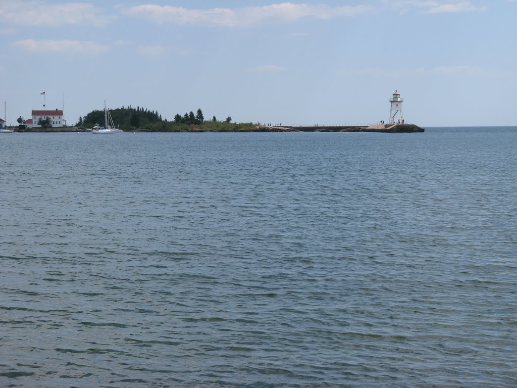 Jul 2007 - Grand Marais, Minnesota. Lighthouse between the harbor and Lake Superior. by BRIAN ZINNEL