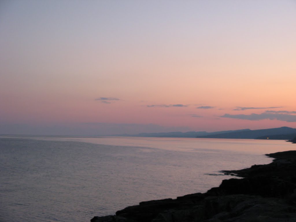 Jul 2007 - Grand Marais, Minnesota. Shore of Lake Superior at sunset. by BRIAN ZINNEL