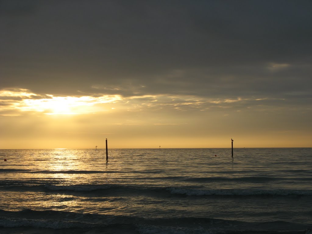 Dec 2007 - Clearwater, Florida. Sun going down on Clearwater Beach near Tampa on the Gulf of Mexico. by BRIAN ZINNEL