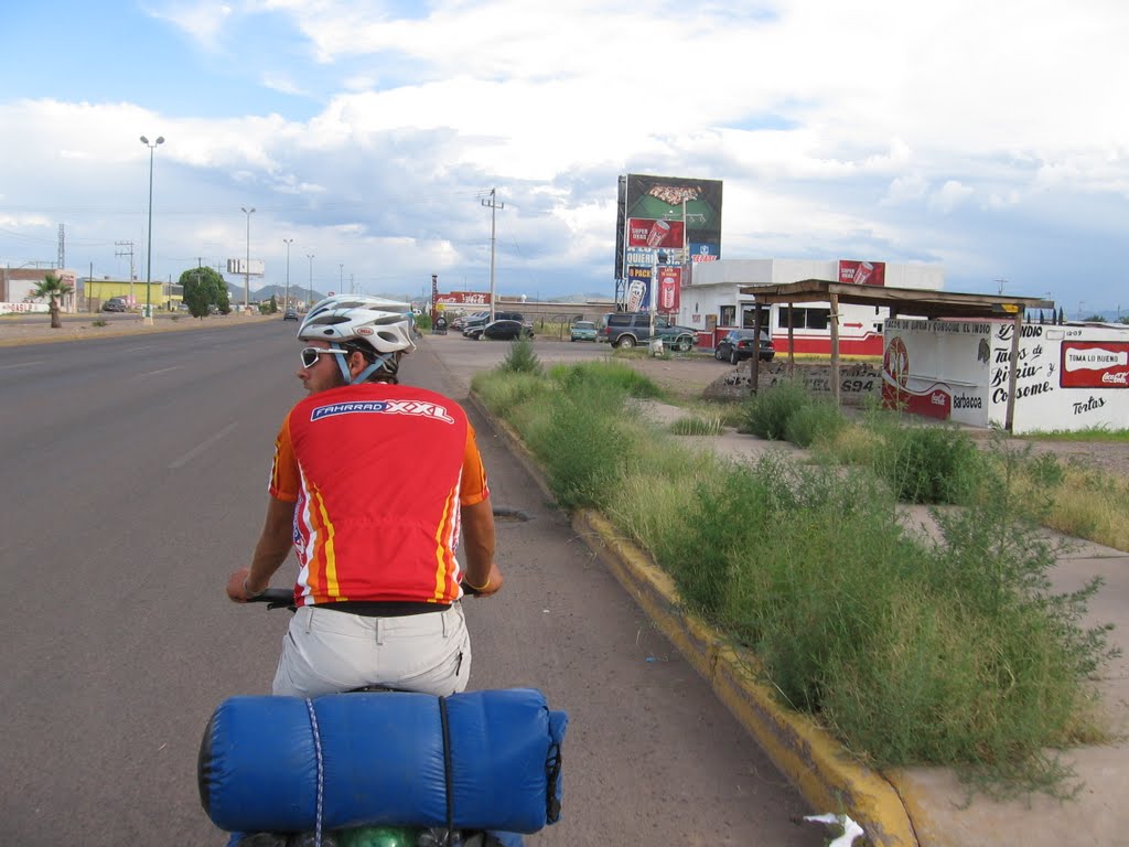 After Nueva Casas Grandes, Chihuahua MX ... On the Mex 10 road almost all the way. Small food and drink stands fill the streets. Most of the commercials are for Coca-Cola or Tecate (a cheap Mexican beer ... tastes like Bud Light ... blechhh!) Jeremy Boissel More info http://www.ukFu.eu by YouGuysAreAmazing