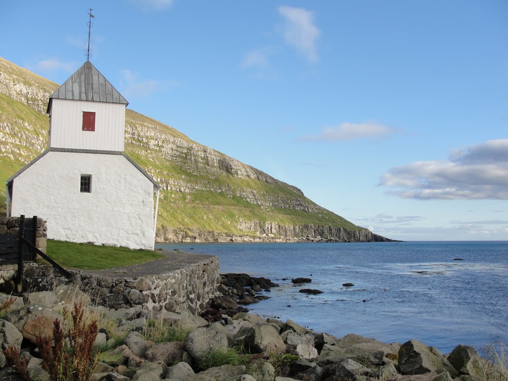 Church and landscape in Kirkjubøur on Streymoy, Faroe Islands by rickgoossens