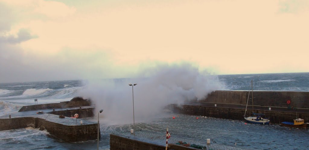 Heavy seas lash the New Harbour Portsoy on the last days of October 2006. by Gilbert Smith