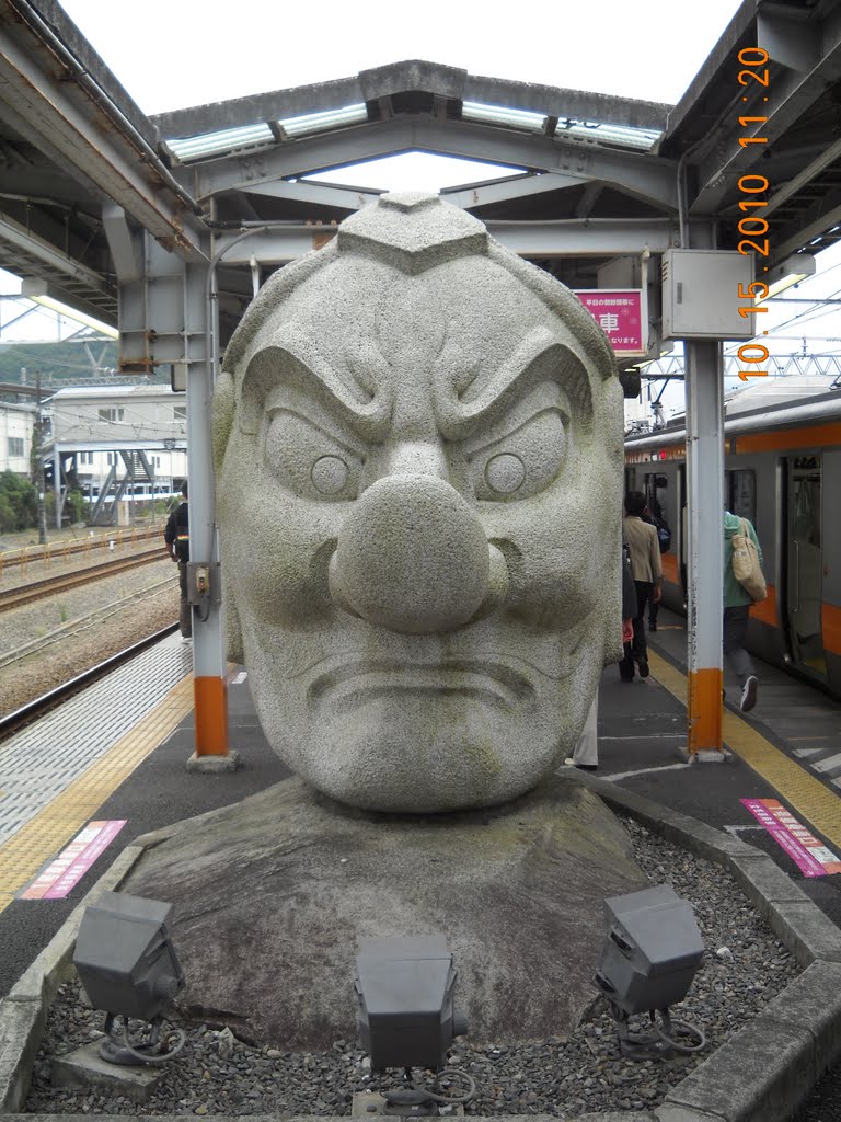 Statue at takao station by japansean