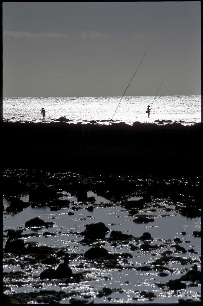 Fishermen at work on Gili Travangan by zwetkoff