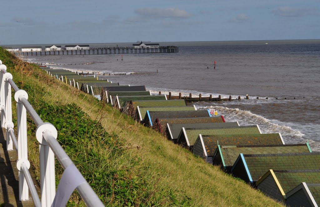 Beach Huts and Pier Southwold with wet paint on rail ! by hemeloid