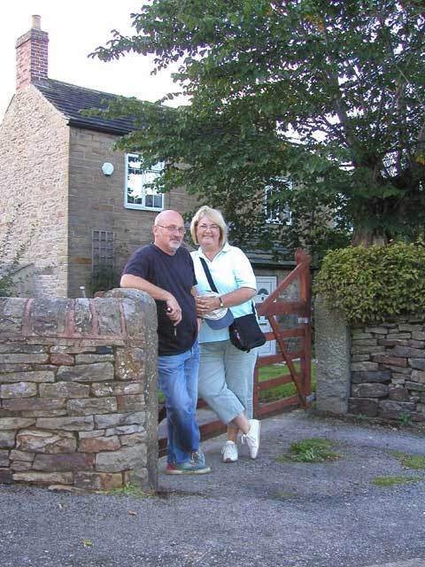 Adrienne & Martin outside their hosue in Barlow by Stewart Walker