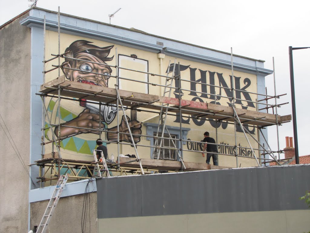 Painting a Think Local Sign by Florian Simetsreiter