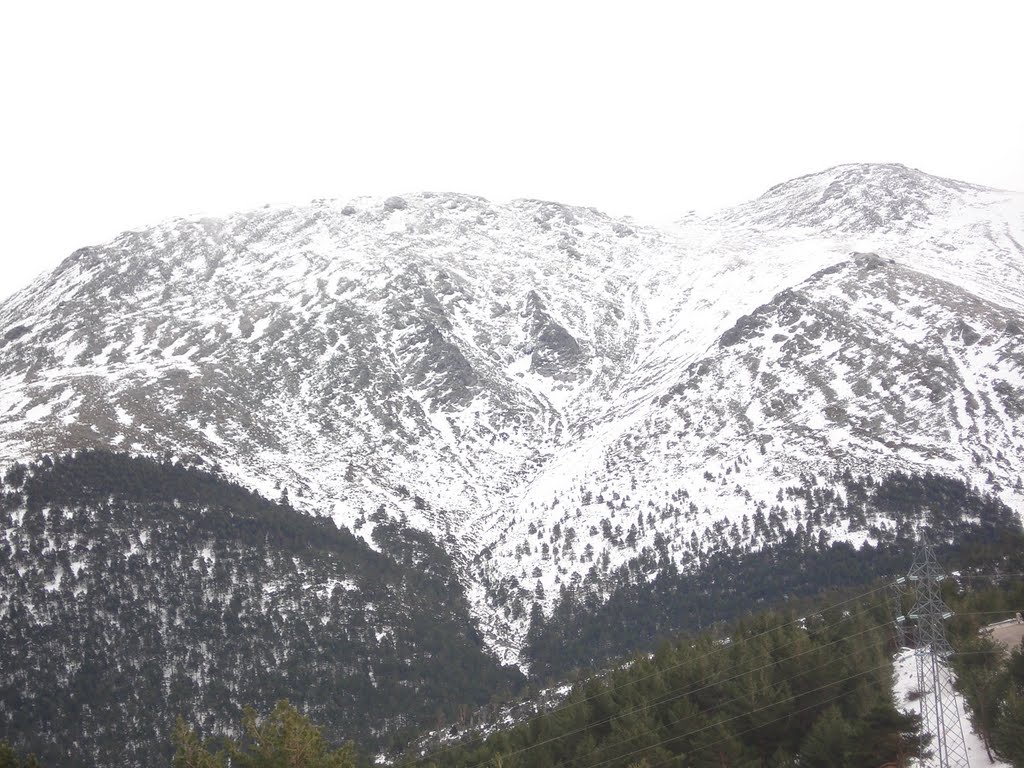 A VIEW OF THE SNOWED NAVACERRADA'S MOUNTAINS FROM COTOS, SIERRA DE MADRID, SPAIN by GIGLIOLA VIGNOLA