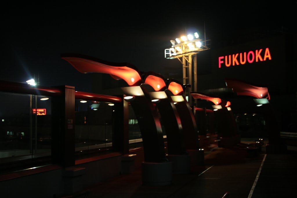 Fukuoka airport at night by Claudio Nakahara