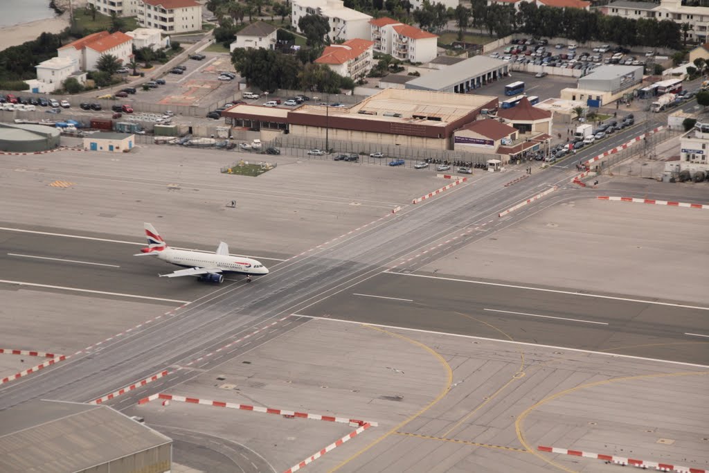 Main road is crossing Runway, Airport, Gibraltar, UK by Tomasz Bukowski