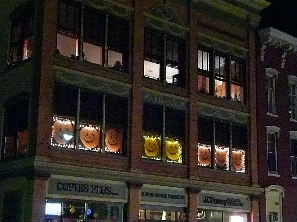 Pumpkins in windows by Geraldine Clark