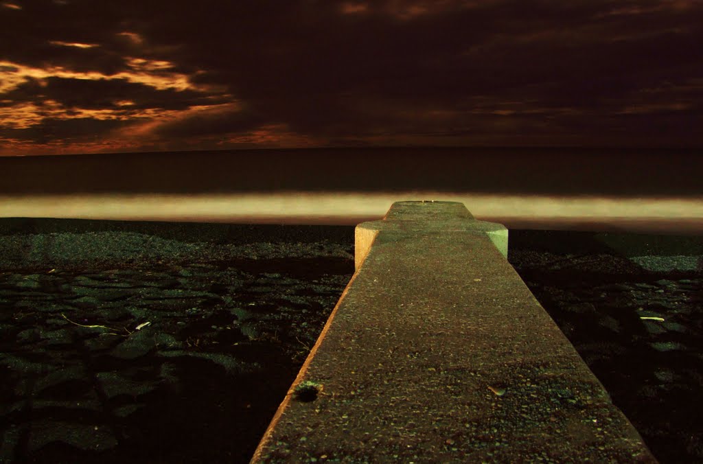 Stormwater pipe at night, Napier foreshore. by Lyndon