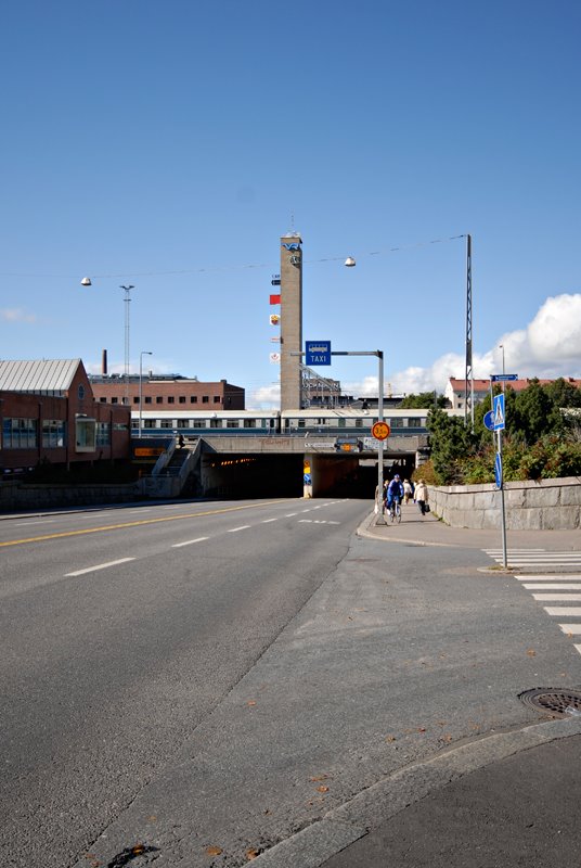 Itsenäisyydenkatu with train station tower clock. by Janne Ranta