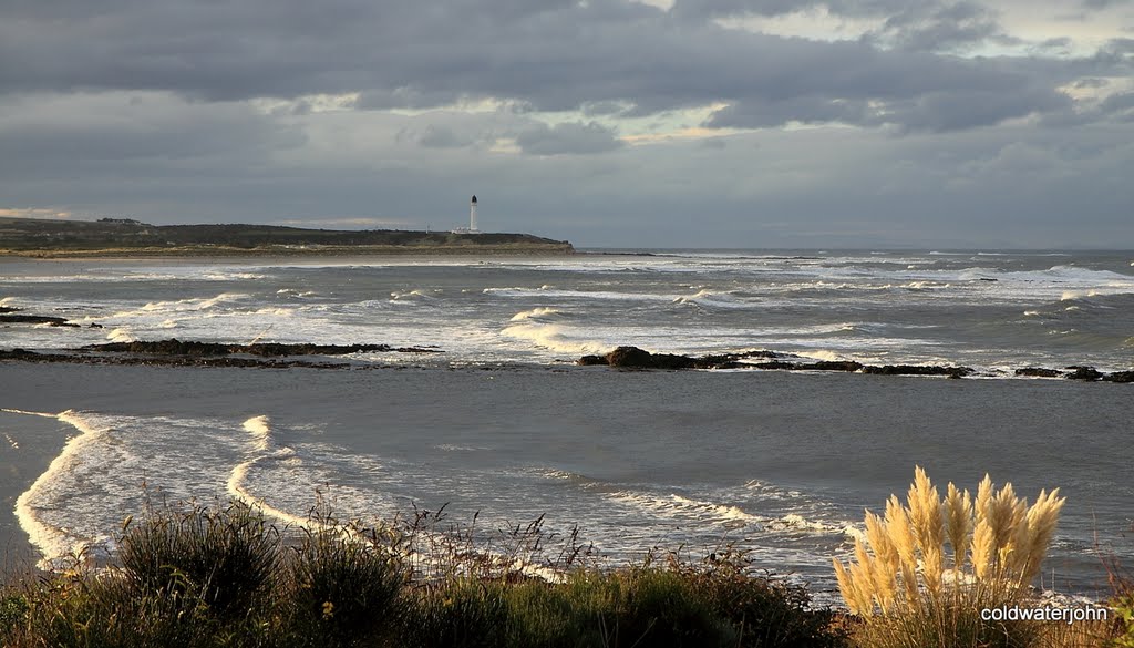 Covesea Lighthouse from above Lossiemouth West Beach on a wild winter afternoon by coldwaterjohn