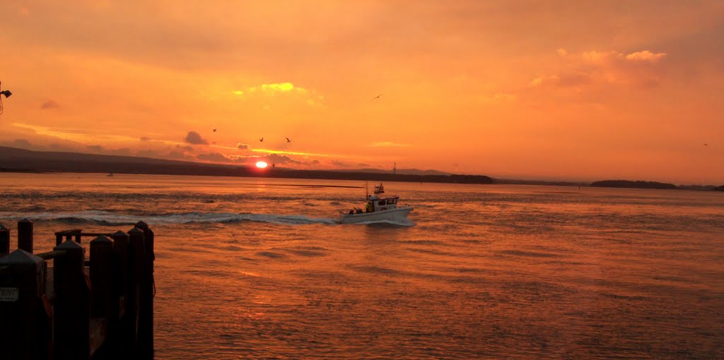 Boat and Sunset Facing Studland from Sandbanks by whitesurf2000