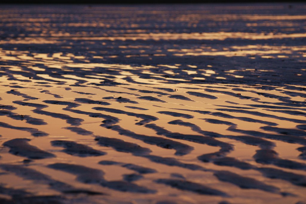 Sky reflection on the beach. by kristine hannon