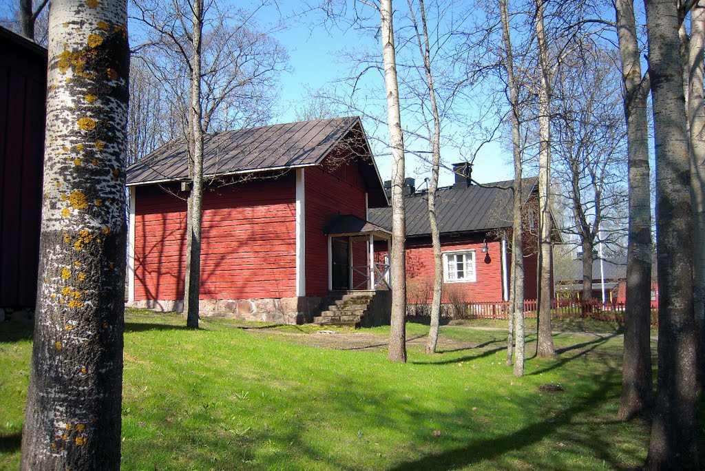 Red ochre buildings by Petteri Kantokari