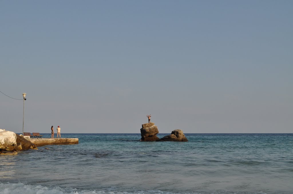 Rock on golden beach by kokijan