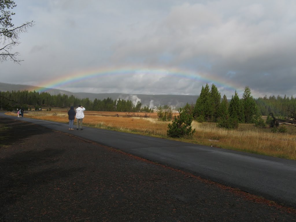 Complete rainbow, Old Faithful, Yellowstone Park, Wyoming by David Kanzeg