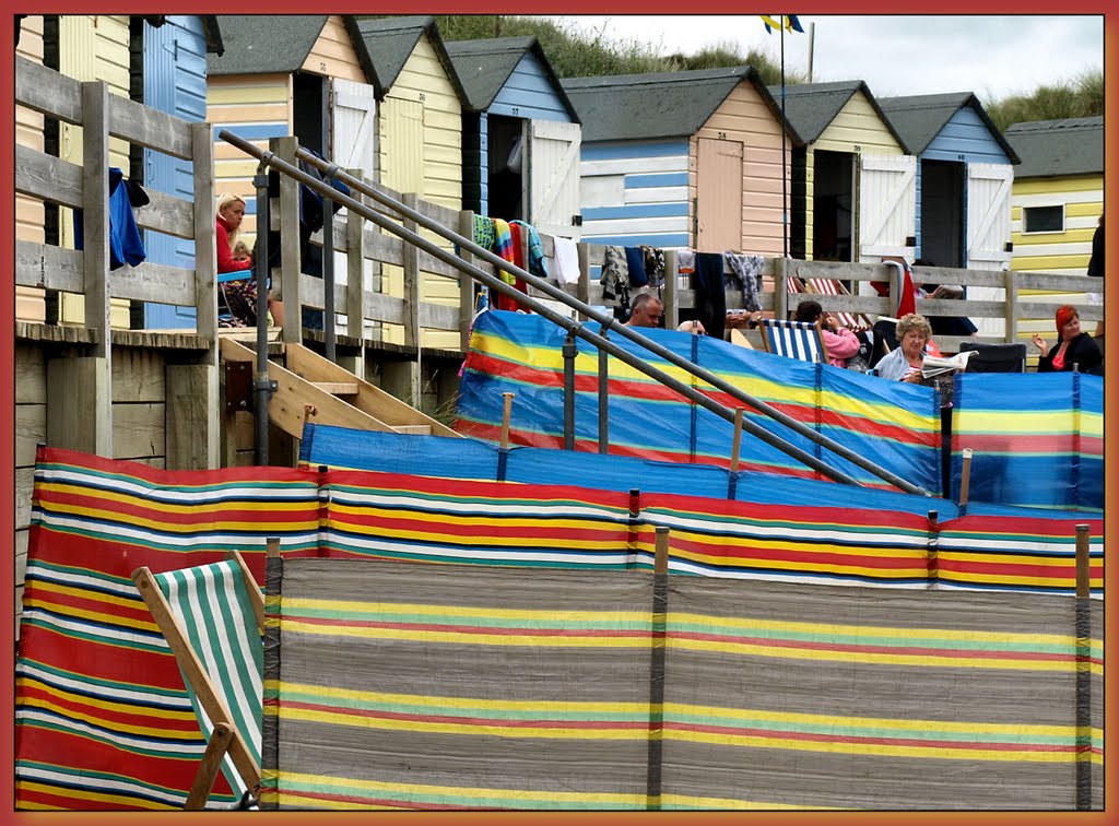 Summer Time, and the beach huts are busy....UK... by Herb Riddle