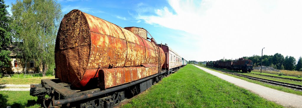 Panorama with a rusty tank wagon by Petteri Kantokari