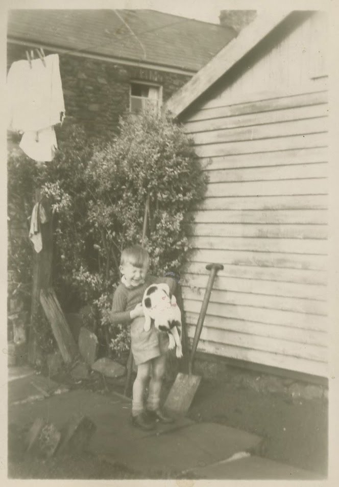 Gwynfor Davies with cat. Wells Hill about 1928. by davies.family