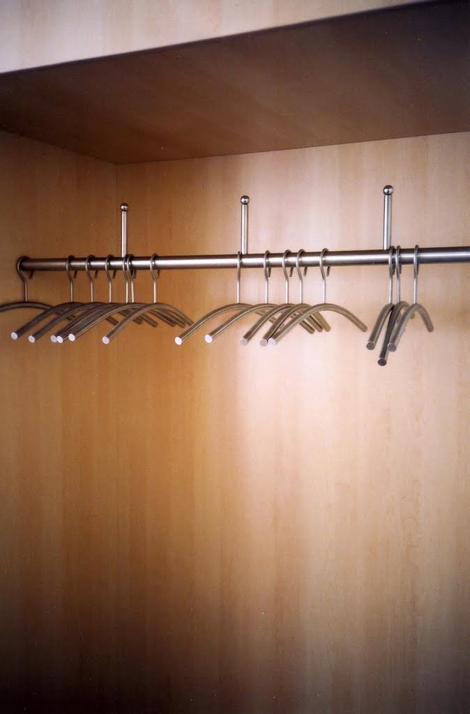 Buchenwald: Empty coat-hangers in Buchenwald Concentration camp visitors cafeteria by Peter Grafton