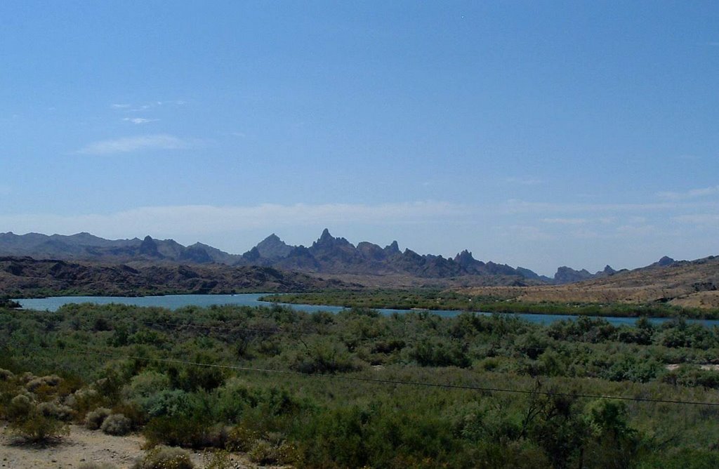 The Colorado flows south toward the Needles and Topock Gorge. Looking southeast from the Red Rock Bridge, I-40 and Hwy 95. by Wayland Del Mar