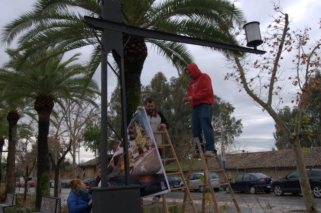 Los artitas trabajando bajo la lluvia by Joaquin Alejandre