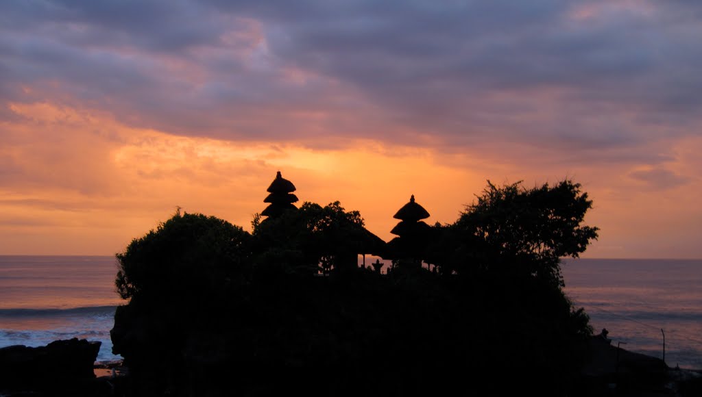 Tanah Lot and its famous sunset. February 2010. by Lukas Eddy