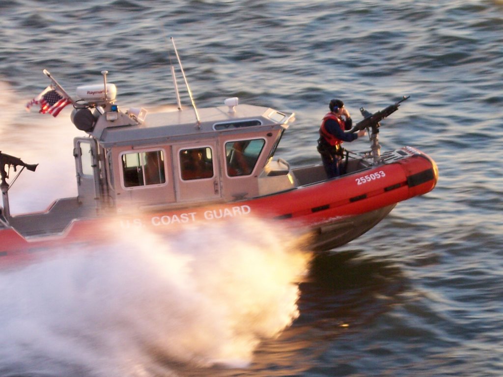 US Coast Guard boat escorts the Staten Island Ferry by Mohamed Shams