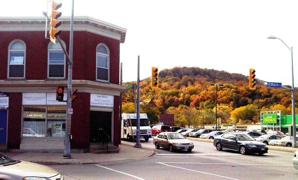 Downtown Grimsby with the fall colours on Grimsby Point in the background by mseaman