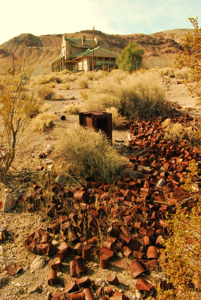 River of discarded cans, Las Vegas & Tonopah Railroad Depot in background, Rhyolite, NV. by Jim Nieland